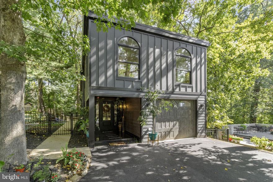 Nestled on a spacious wooded lot in the sought after Fallswood community, 1408 Fallswood Drive is your gateway to luxurious living. This single-family home offers the perfect combination of style, space, and modernity. With 3,944 total square feet, it presents a captivating lifestyle opportunity with 5 bedrooms, 4.5 bathrooms, and an abundance of living spaces across its three levels. The main floor offers an inviting entryway and an open-concept modern kitchen, featuring a thick marble island, top-of-the-line stainless steel appliances, under-cabinet lighting, and modern chandeliers. The living area, embellished with hardwood flooring and a ceramic-tiled fireplace, offers a cozy retreat. A spacious walk-in pantry and a wide modern slide door leading to the first of two large decks complete this level. Upstairs, the primary bedroom features a large walk-in closet and modern en-suite bathroom complete with heated flooring, soaking tub, and glass enclosed shower. Three additional bedrooms, two full bathrooms, and a large sitting/lounge area ensure plenty of space for all. The fully finished walkout basement, with double doors leading to the outdoors, is equipped with a kitchenette, storage, and offers two living areas, fifth bedroom, and updated en-suite bathroom. The basement boasts granite and marble finishes, adding an elegant touch. The outdoor living spaces are a private oasis, featuring a granite entry, a walkout deck from the kitchen, a lower-level deck, and two side patios for relaxing and entertaining. The large front yard is filled with trees and landscaping, and you'll find the hammock and wooden swing create the perfect spots for unwinding. A storage space under the deck, modern outdoor lighting fixtures, expansive driveway, and attached garage enhance the property's functionality and ambiance. Easy access to I-270, R-355, Metro, Montgomery College, Rockville Town Center, Lakewood Country Club, Shady Grove Hospital, Rockville Pike, and more! Don't miss this exceptional opportunity to own a piece of Potomac's finest living.