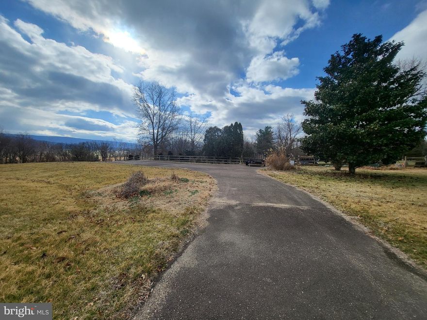 What more could you ask for in a building lot? Here you have gorgeous views of the mountains and river.  The lower portion of the lot is river front with a cleared spot for you to hang out and have a good time.  The upper level of the lot boats an installed driveway, underground propane tank (3/4th full), electric, and water and sewer.  Grab your builder and start planning the home of your dreams.  Oh yea, also at the end of the road on the culdesac for the ultimate in town privacy.
Call your agent today to set up a showing.