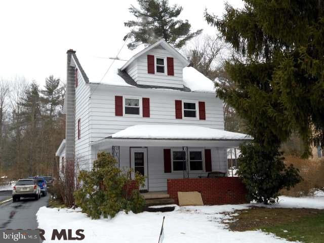 Spacious home in lovely Woolrich. Hardwood floors, in the majority of the first & second floor rooms. Additional bonus room in attic with heat that can be used for a living space and/or storage. This home has new windows in 2007, new roof in 2012, large rooms, quaint front porch, covered back deck, central air, detached two-car garage. Listing agent related to seller.