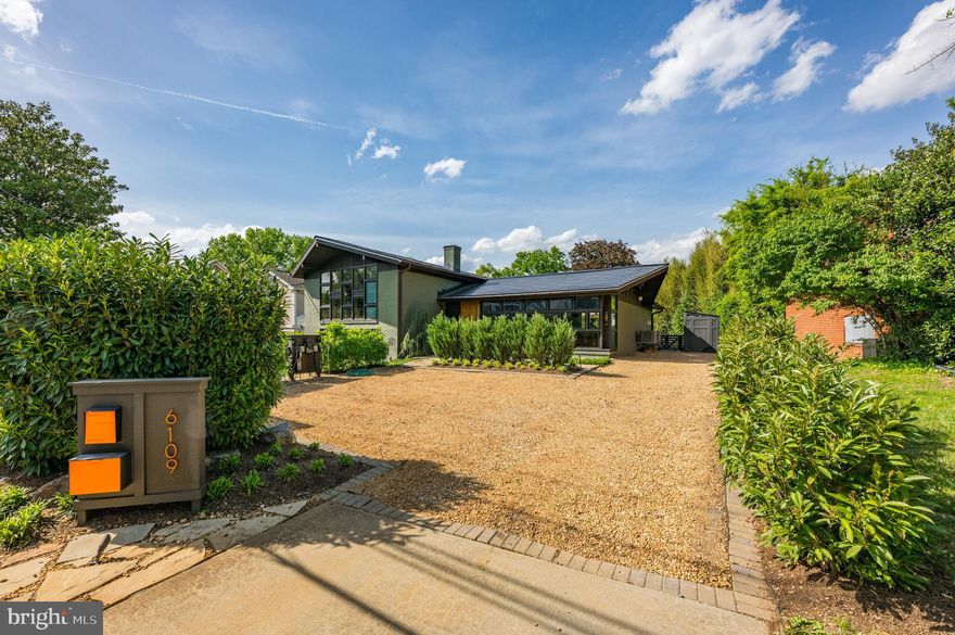 Modern Elegance in the Heart of Bethesda. Welcome to 6109 Greentree Road — a fully renovated and expanded mid-century modern masterpiece nestled in one of Bethesda’s most desirable neighborhoods. This stunning four-bedroom, three-and-a-half-bath home has been reimagined with impeccable attention to detail and the highest quality finishes throughout. The open, airy design harmonizes sleek modernism with timeless comfort, offering spacious living areas, two Heat & Glow gas fireplaces, and a seamless indoor-outdoor flow. The beautifully redesigned gardens feature lush landscaping, multiple patios, and parking for four vehicles in the front. The gourmet kitchen is a culinary dream, boasting an impressive suite of Miele appliances including a built-in wall oven, steam oven, 36” refrigerator/freezer, and coffee system. A separate bar area with under-counter wine cooler and dishwasher ensures effortless entertaining, while the Miele-equipped laundry room offers high-efficiency performance on a waterproof floor. Every detail supports sustainable luxury—from the Tesla solar shingle roof and four Powerwall batteries to two EV charging stations and a 17 kW solar system tied to a Pepco net-zero meter. The home’s intelligent infrastructure includes a 400-amp electrical service, LED lighting throughout, advanced HVAC with Bosch and Panasonic systems, and an Aqua Pure water filter. Environmentally conscious design features like double-pane Argon gas windows and passive solar orientation reduce energy use while maximizing comfort. Premium finishes in oak, stone, tile, and glass add sophisticated texture and warmth. 6109 Greentree Road is more than a home—it's a refined lifestyle powered by innovation, comfort, and timeless design.