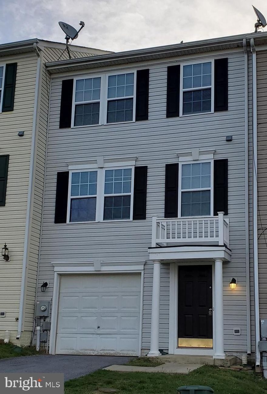 Large, light-filled 3 bedroom, 3 1/2 bath townhouse with oversized windows on all 3 floors. Walk-out rear deck, garage, and walk-out finished basement, one of the larger and more spacious units available. Easy access to route 9 and I-81 for commuting, yet tucked away in a private location backing to the golf course with a great view from the rear deck.  Hardwood and laminate flooring throughout the home.  The kitchen floor was just refinished and is beautiful.   Washer & dryer in unit.