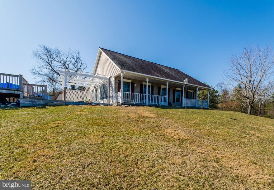 Views, Views, Views. Long distance views of Sleepy Creek Mountain from the house. The large front porch welcomes you into this well-kept home.  Brand New- 95% efficient Combi Boiler for instant heat and water. Spacious, ranch home with 3 bedrooms, large walk in closet in Master Bedroom, 2 full baths, lots of natural lighting in the living room and dining room, kitchen with Corian counter tops and pantry.  Nice wood looking laminate flooring.  Light and Bright full unfinished basement.  Attached double car garage with access to the house.  Enjoy the mountain view when in the above ground pool with propane heater.  The house is equipped with a whole house generator.  Just in case you need it! As the sun sets come and see the wildlife.