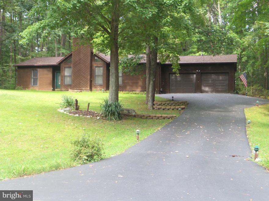 Lovely Rancher In Great Community Near End of Cul-de-Sac. House Sits On 1.81 Acres. Nicely Sized 3 Bedrooms & 2 Full  Baths. Spacious Living Room Has Cathedral Ceilings & Wood Burning Fireplace. Sliding Doors Off Dining Room Overlook Deck & Flowering Trees. Two Car Garage Has 576 sf. With Lots Of Space For Cars and Toys. Roof & Other Major Systems Replaced Approximately 6 Years Ago.