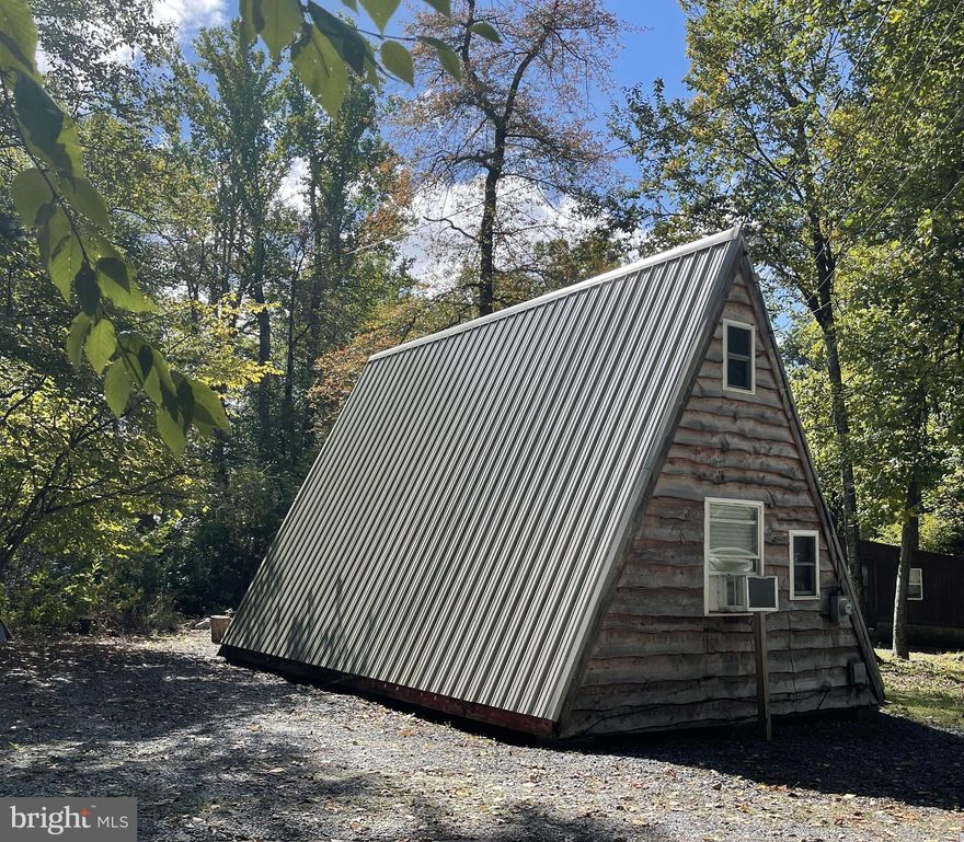 Fish, Relax, Vacation or Live in this Cozy 1 Bedroom, with 2nd Bedroom in loft, 1 Bath A-Frame. A-Frame is right on the Conococheague Creek, Creek is stocked by the Game Warden every April. Amish Electric Heater • Hemlock siding on front and back • Metal Roof • Creek front stone firepit • New front door • New ceiling fan • Waterproof floor tiles in front room and bathroom • New 25 gal water heater •  Amish built and installed kitchen cabinets with pullout drawers, fridge, and stovetop, • Creek front property with private steps down to creek •  Only minuets from Caledonia State Park, Minutes from Route 30 and Route 81. Call today for your private tour. **On Rented Land - CASH ONLY** In Flood Zone** Land Owner will not allow you to Lease OUT as a short term Rental - Air B&B, etc.
