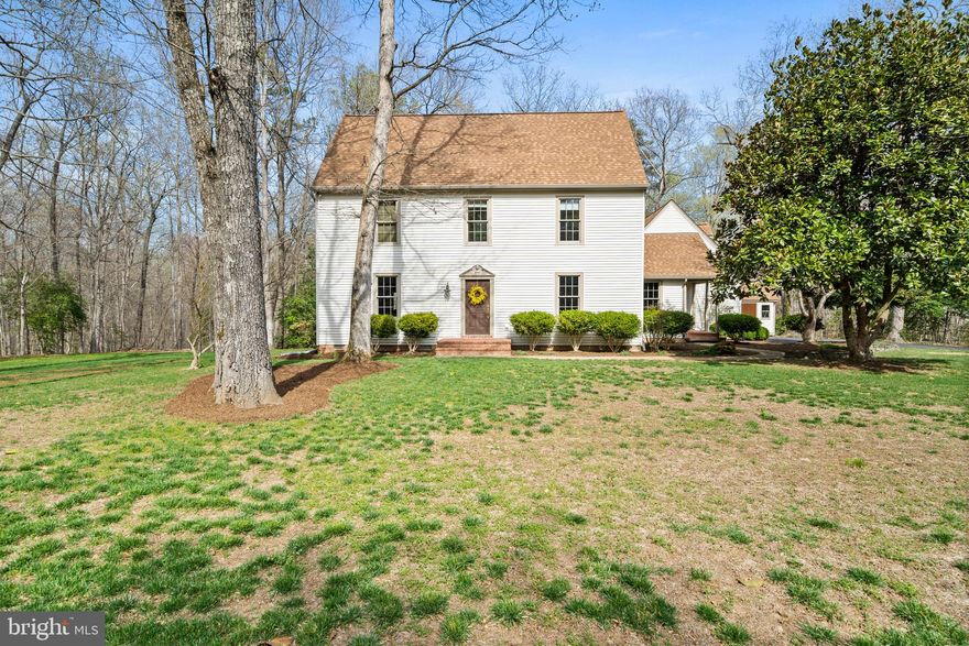 Located toward the end of a long, paved private drive within the Abells Ridge community, this classically beautiful Saltbox home will capture your heart as soon as you pull into the curved driveway. You'll want to call this HOME for decades to come. Sitting on an elevated 4+ acre parcel, surrounded by serene woods, it feels like a world apart, yet it is conveniently located to all your needs. Custom built with quality craftsmanship inside and out, lovingly cared for. You simply must take a tour to appreciate the fine details, from the brickwork and stacked stone hardscaping outside to the hand-crafted trim and the solid heart of pine floors inside. Plenty of windows and dormers for natural light, a gas fireplace, and a traditional floor plan create a warm, inviting living space like the days of yore. The primary suite and two spacious bedrooms are located upstairs. A finished bedroom with an en suite bath over the oversized 2-car garage makes a pleasant, separate living space for an in-law or roommate, or it could be a quiet space ideal for a home office. There's so much more to discover during your tour! Note that the property has a Hollywood address with Leonardtown amenities. As they say, home is where the heart is. This is it, the one you've been searching for.