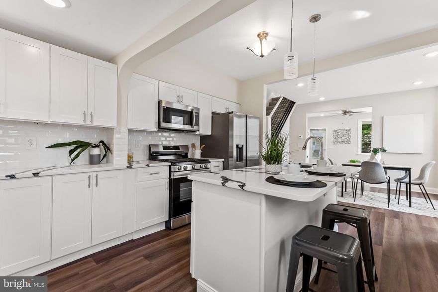 Welcome to 4508 Raspe Ave. This move in ready home has everything that you are looking for. Open the door to a beautifully designed open concept living room, dining room and kitchen. The kitchen boasts brand new quartz countertops and a 6 foot long quartz island ready made as an eat in kitchen. It comes fully stocked with top of the end stainless steel appliances. The main level has two spacious bedrooms that pour in natural light. Each floor has its own full bathroom which gives this home more versatility than anything else that you will see. Upstairs you will find two more bedrooms that are great for guests, kids or your own master suite.  The full finished basement adds almost 1,000 addition square feet. With carpeted floors, a full bathroom and 8ft ceilings, this basement just needs your creative touch. The exterior of Raspe offers a cozy covered front porch while the backyard is perfect for entertaining.  With a brand new AC unit, furnace and HWH this home is only missing you! Come pull in to the new parking  pad and visit Raspe before it's gone!