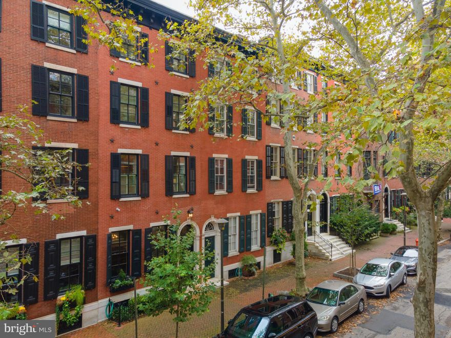 Nestled on the most desirable block in Philadelphia, welcome home to 1816 Delancey, a magnificent, one-of-a-kind renovation.   A true architectural oasis, this almost 4,700 square foot town home showcases  the recent complete renovations with the highest quality luxury craftsmanship and design, while respectfully conserving its historical significance as home to Mary Curtis Bok, the founder of the Curtis Institute of Music.  Stepping through the gracious vestibule entrance, the main level opens to a grand foyer with stunning marble accents and original details, including crown molding, period fireplace, marble mantles, and elegant archways.  Enjoy signature, Delancey oversized windows form the entertaining room at front, fireplace, and a breathtaking, engraved ceiling. Continue through the main level to find a butler's kitchen, stately formal dining room, highlighted by stunning windows, brilliant tiling, window benches, and a period fireplace. Upstairs, the second level is the heart of the home, featuring a light filled, gourmet "Joanne Hudson" chef's kitchen with top-of-the-line appliances, gorgeous mill work and cabinetry, and breakfast nook.  Enjoy grilling on the balcony!  The spacious kitchen opens to a large formal dining room, which leads to a custom wet bar, powder room, and cozy living room. On the third level, find the Primary Suite, with an impressive walk-through dressing area, including two walk-in closets and multiple built-ins, a luxurious bathroom with double vanities, huge glass shower, and clawfoot soaking tub. The upper floors offer spacious bedrooms and completely renovated bathrooms, including access to the top floor balcony.  The lower level finished basement is a versatile space for a large home gym, playroom, media room, or guest suite.  This property includes 2 car tandem garage parking, along with a third parking option with an  electric vehicle charging station in front of the home.  Make your appointment now to view this remarkable, urban residence!