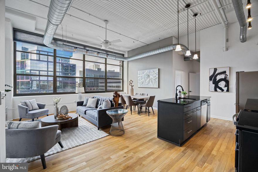 Welcome to 2200 Arch Street, Unit 612 – a rare two-bedroom corner residence offering 1,121 sq. ft. of modern living in one of Philadelphia’s most desirable condo buildings. This home features soaring ceilings, oversized Southern and Western facing windows that provide an abundance of natural light throughout, and an open-concept layout that blends style and comfort. The sleek kitchen is equipped with stainless steel appliances, granite countertops, and contemporary cabinetry, opening seamlessly to the spacious living and dining area. The two fully enclosed bedrooms on the same level are generously sized with excellent customized closet space, while the oversized bath has been upgraded with a full size linen cabinet, marble top storage vanity, AND a wall-mounted towel warmer. What sets this unit apart is its private balcony (one of only 12 in the building) with rare southwest exposure — the perfect spot to unwind and enjoy breathtaking sunsets and sweeping city views. The unit also includes a DEEDED COVERED PARKING space. Residents of 2200 Arch enjoy a host of amenities, including 24-hour concierge service, a fitness center, secure entry, and it is pet-friendly. The location is unbeatable — just steps from Trader Joe’s, Whole Foods, the Giant Riverwalk, Starbucks, the Schuylkill River Trail, 30th Street Station, and all of Center City’s premier shopping, dining, and cultural attractions. Don’t miss this opportunity to own one of the building’s most sought-after layouts with a balcony. Schedule your private showing today!