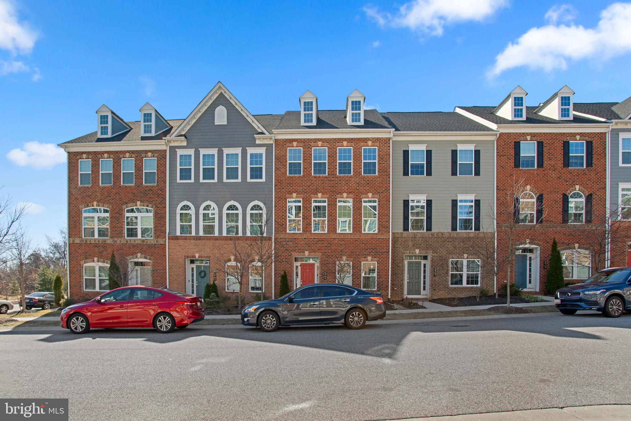 Stunning Colonial townhouse offering 3,062 square feet of beautifully designed living space, 4 bedrooms, 3 full baths, 1 half bath, and a 2-car garage impeccably maintained by the original owner in highly desired Shipleys Grant. The fully finished lower level welcomes you with a spacious foyer and a versatile mudroom area, perfect for a home office or additional living space, with direct access to the garage. Eclectic and elegant design choices define the open-concept main level, starting in the inviting living room featuring plush carpeting and a striking modern accent wall. A conveniently located powder room adds to the home’s functional layout. The gourmet eat-in kitchen is a chef’s dream, showcasing hardwood floors, quartz countertops, stainless steel appliances, ample rich cabinetry, an island with seating illuminated by stylish pendant lights, and a chic arabesque backsplash. The adjacent dining area exudes warmth and character with an accent wall and hardwood flooring.
On the upper level, you’ll find a laundry room, two full bathrooms, and three spacious bedrooms, including the bright and airy primary suite with a tray ceiling, a walk-in closet, and an ensuite featuring dual sinks. The uppermost level offers a private retreat, complete with a bedroom, attached full bath, walk-in closet, and access to a sprawling rooftop deck—ideal for relaxing or entertaining. Enjoy resort-style amenities in Shipleys Grant, including a community pool and clubhouse.