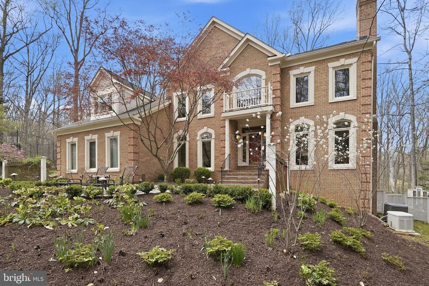 Nestled in the treed landscape of Great Falls, 182 River Park Dr is a private sanctuary where luxurious living meets serene surroundings. Spanning 1.76 acres of fenced privacy, this property offers an unparalleled sense of tranquility, enveloped by lush greenery and vibrant gardens. With 5 spacious bedrooms and 4.5 bathrooms, there's room for everyone to live in comfort.

As you step inside, you're greeted by an airy, light-filled design in the formal living and dining rooms. The open kitchen, featuring brand-new appliances, flows effortlessly into the great room, where walls of windows frame picturesque views of treetops and blooming gardens. It's a space that feels both expansive and intimate, perfect for quiet mornings or lively gatherings.

The upper level primary suite is a retreat unto itself, with a fireplace in the sitting room for cozy moments, a tray ceiling to induce the best nights sleep and a luxurious bath that includes dual vanity, a soaking tub and separate shower—your personal escape at the end of the day. Three additional bedrooms share access to two well appointed full baths.

The lower level extends the luxury lifestyle, offering a recreation space, fully equipped gym, a wet bar, a kitchenette, an infrared sauna and plenty of storage. With a bedroom, full bath, and walkout access to the gardens, it’s a versatile space that accommodates guests or multigenerational living.

Outside, discover spaces designed for both entertainment and solitude. Flagstone patios and a fire pit beckon for cozy evenings under the stars, while the sport court satisfies your competitive side with room for pickleball or basketball. The expansive deck, equipped with a gas line hook-up, is tailor-made for al fresco dining or summer cookouts. And if you're looking to explore, direct access to the Potomac Heritage Trail takes you on an adventure to the Potomac River, a haven for nature lovers.

Completing this exceptional property is a spacious 3-car garage, ensuring ample room for vehicles and storage. Offering privacy, serenity, and an unmatched connection to nature, this home is a dream come true for those seeking a lifestyle of elegance and ease.