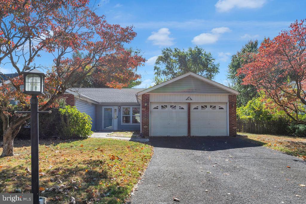Welcome to 4 Westwood Ct, Newtown! 3 beds 2 full bath rancher in Newtown Crossing. Large living room, rear den with wood burning fire place, 2 car garage, covered rear porch, private back yard with just shy of a 3rd of an acre. Come put your finishing touches on this single family home. 3 large bedrooms. Roof was replaced in 2018. Home is complete with a high efficient furnace. Showings begin Friday 10/18, open house Sunday 10/20 from 11:00-12:30