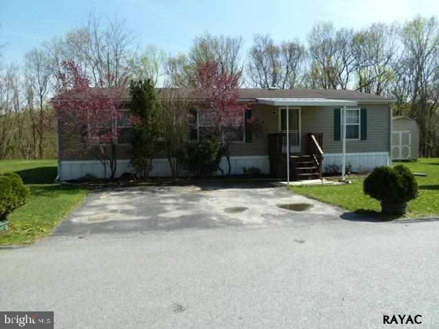 Country feel! 1999 double wide in great condition. Nice setting with woods in back. Large kitchen with loads of cabinet space. All appliances including washer/dryer. Brick patio. Propane tanks are rented.