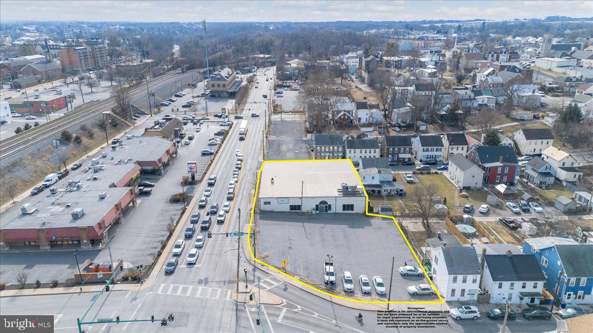 This well situated property offers high visibility with well over 12,000 daily traffic count. The building could be used for a variety of uses and includes a large paved parking lot adjacent to the building. The interior of the building offers 9,400 square feet with the bulk of that space being an open floor plan. Drive-in access is available through the side roll-up door. The building includes a wet sprinkler system, natural gas service, 2 zones of heating/cooling, brand new heating/cooling system, metal roofing, 2 private offices, storage area, floor drain and plenty of windows fronting on three streets. This location and space offers plenty of interior visibility and would work great as a retail space and showroom as well as most other commercial uses.