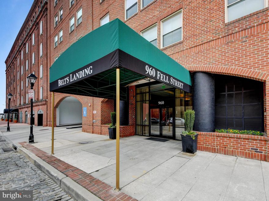 Welcome to this lovely, fully renovated two bedroom, two bathroom condo in Belt's Landing - in the heart of historic Fells Point. This well-kept home is move-in ready! The contemporary kitchen sparkles with quartz stone countertops and stainless steel appliances, and has plenty of storage options with quiet-close cabinets and a walk-in pantry. The combined dining and living room is wide open and impressive with blonde bamboo flooring throughout. Follow the hallway to the bedrooms, where you'll find a roomy bedroom and the updated hall full bathroom. Beyond that is the spacious primary bedroom, complete with built-in shelving, and walk-in closet, as well as the expansive and updated primary bathroom with double sink vanity, storage, and beautiful stall shower. Both bedrooms are complete with blackout shades.   The building itself is located on the waterfront. During the summer, relax by your private pool with views of the water, or enjoy some fresh air in the community courtyard. Parking is made easy with your two unassigned parking spaces in the attached garage, with additional guest parking as well.  Enjoy the building's additional amenities, including exercise room, marina, and 24 hour security. Your new home is walking distance to all of Fells Point's restaurants and shops. Seller is motivated!