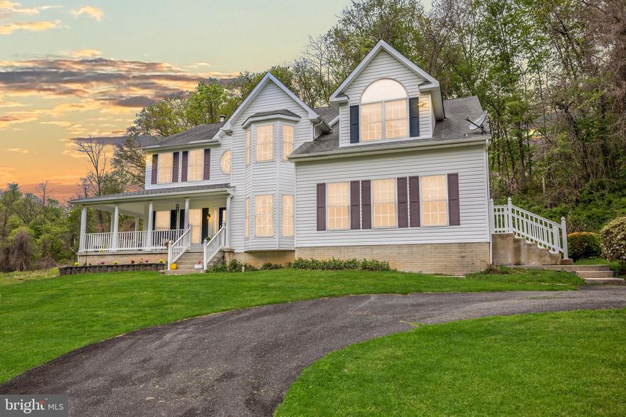 Situated on five private acres, this unique property offers a blend of significant interior scale and outdoor versatility. The grounds include a private pond complete with ducks, and ample space for those interested in gardening, chickens, or homesteading projects. With over 5,300 square feet of living space above grade, the main residence features an open floor plan designed for both comfort and practicality. The main level includes an extra-large kitchen, sitting room, dining room, and a dedicated home office, complemented by two distinct living areas: a bright, sun-drenched room at the front of the home and a central family room anchored by a dramatic two-story stone fireplace.
The upper level is home to four bedrooms and two full bathrooms, highlighted by a notably large primary suite. This retreat features vaulted ceilings, a private sitting area, a walk-in closet, and a spacious ensuite bathroom. Additional living space is found in the finished lower level, which provides a recreation room, another full bath, and three separate storage areas.
Beyond the main home and the detached two-car garage, a separate exterior building houses a shop and apartment space. While these areas require some renovation, it offers excellent potential for rental income, a guest house, a workshop, or a professional home-based business. This property is ideal for a buyer seeking a private, expansive setting with the flexibility to support a variety of lifestyle and professional needs.