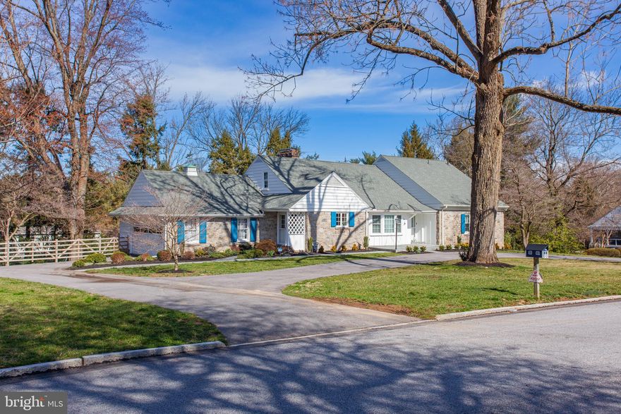 Embrace the allure of this captivating residence, where sunlight dances through every corner, offering a picturesque vista from the sunroom, family room, and dining room.  Boasting almost 4,000 square feet of living space, this home is a testament to refined comfort and timeless elegance. Step inside to discover solid hardwood floors throughout most of the first floor creating an inviting atmosphere bathed in natural light. The expansive deep seated, newly installed windows frame breathtaking views, inviting the outdoors in and creating a sense of serenity throughout. Culinary enthusiasts will delight in the custom cabinetry of the kitchen, offering ample storage and a pantry for organization.  Enjoy family meals knowing everything is at your fingertips in this thoughtfully designed space. The main floor features two gas-burning fireplaces, adding warmth and charm to the spacious layout. There is an expansive family room, a breakfast retreat and a spectacular sunroom which would make the most perfect home office. Retreat to the first floor primary bedroom ensuite for ultimate relaxation and the second main floor  bedroom could be used as an office or playroom.  The sunroom offers panoramic views of the heated pool and expansive fenced-in yard, creating an idyllic setting for every occasion.  Ascend to the second floor, where an oversized bedroom awaits with walk-in closets and ample space for customization. Transform this area into an in-law or nanny quarters, or simply enjoy the added flexibility it offers.   A full newly refinished bathroom adds to the convenience and comfort of this level. The lower level beckons with another large family room featuring a gas fireplace, a full bedroom and bath, plenty of unfinished storage, a laundry area, and a vintage wet bar.  Step outside to the spacious fenced-in yard, where the pool awaits, surrounded by lush landscaping.  There is an oversized 2 car garage  and a governor's driveway which further enhances easy accessibility to the wonderful layout of this home.   Whether lounging poolside or hosting gatherings, the outdoor space is sure to impress. Nestled in a desirable neighborhood, this 5 bedroom,  4.5 bath home offers easy access to amenities, schools, and major commuter routes, ensuring convenience without compromising on privacy or tranquility.