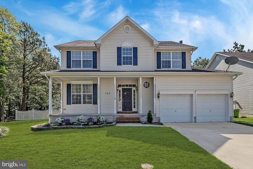 Beautifully updated home backing to forested conservation area. Perfect yard for summer entertaining with large deck, paver patio and lighted pergola with hot tub. Enjoy cooking on your gas stove and nights spent in front of your gas fireplace. Refinished hardwood floors throughout the main level. Owners beautiful updates make this home perfectly move in ready!