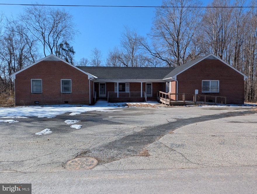 Commercial Property located behind Cumberland Courthouse on Foster Road. Brick property with lots of office space and plenty of bathrooms. Could possibly house multiple commercial businesses or multiple rentals. Equipped for wheelchair access. Great Investment opportunity. AS-IS where is.