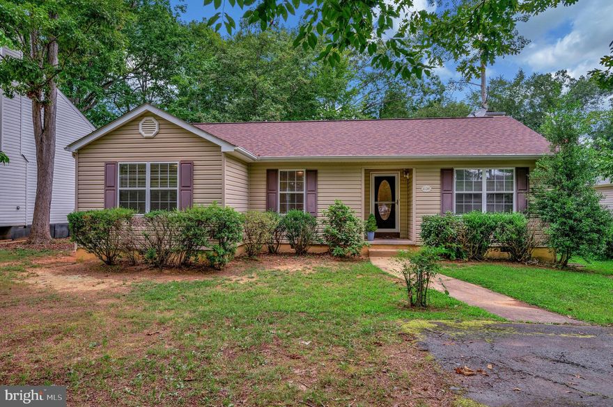 The window over the sink holds a restfull view of the long backyard! Coffee on the desk  is a fab way to begin your day. .... or end it with friends & a BBQ. One level living close to the community entrance & tot lot.  This neighborhood is Convenient to nearby shopping, eateries,  & local businesses.  Setback off the street for privacy with some mature plantings is this home awaiting its new family.  It feels open and airy with its vault ceilings though it is a traditional floor plan offering  separate dining and living rooms plus the popular family room off the kitchen. The family room sports  two skylights, a wood-burning fireplace with a mantle & marble floor hearth. The kitchen has oak cabinetry & is both compact & efficient. There is a laundry closet that can be closed off from company view. Luxury vinyl plank flooring is easy maintenance & brightens the living area. Deck freshly stained.  Roof August 2023 conveys with warranty. HVAC  installed November 2013.