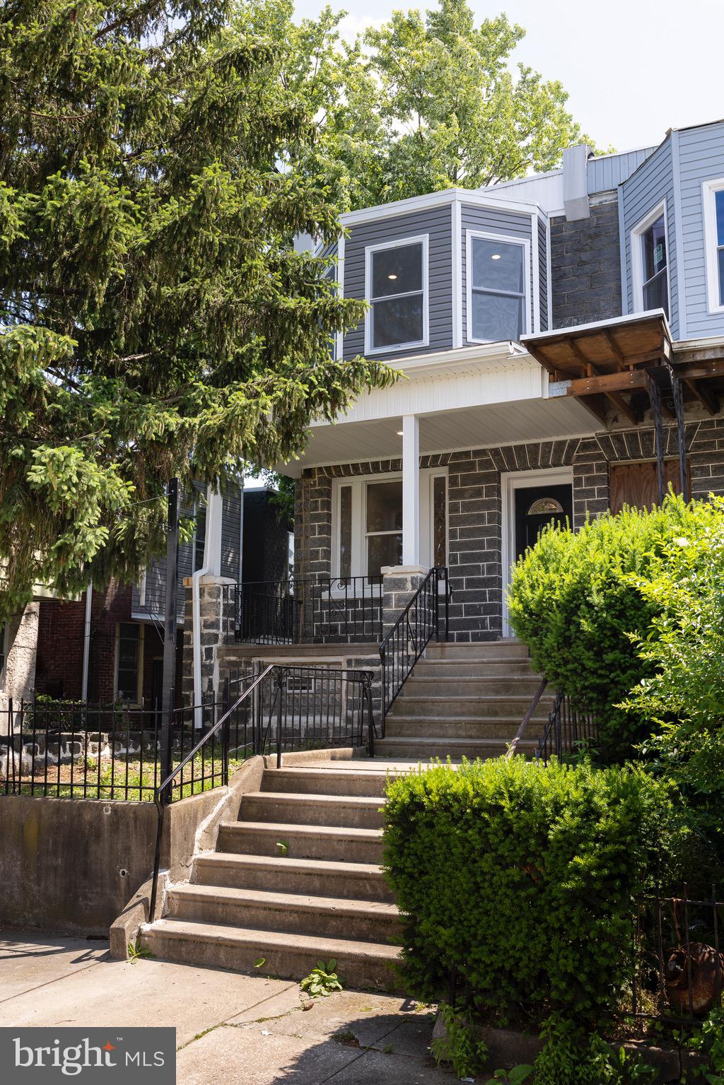 Full remodeled end of row in Cobbs Creek. This home is a tasteful blend of original features and modern comforts. You can have your hardwood floors, original stairs and banisters as well as your updated kitchen, bathrooms and central air. The first floor is spacious and open with great lighting. The brand new kitchen has all the bells and whistles including a half bath and storage nook all leading out to the back porch and a spacious yard. As you head upstairs you'll find a master bedroom complete with its own private bathroom. There's another full bathroom down the hall as well as laundry. The two other bedrooms are spacious and inviting on their own. Basement is unfinished but clean and could be perfect for storage, work out area, studio etc. Plus walk out access to the back yard. Come check it out today!