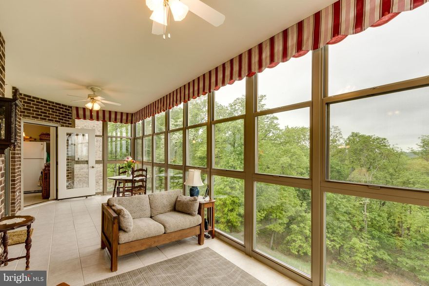 BEAUTIFUL  2 Bedroom/ 2 Bath PLUS DEN condo! Relax on your spacious glass enclosed sunroom with GREAT views of the community and nature. This contemporary floor plan has a fireplace, Corian counters, stainless steel appliances, Ceramic tile in bathrooms, balcony, and kitchen, double vanity in  Master Bathroom, and EXTRA Large Storage Space (shelves convery)  and large GARAGE SPACE INCLUDED!