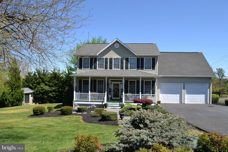 REDUCED!! OPEN SUN. OCT 2nd 2:00-4:00 Pristine condition custom colonial in Town but not in HOA subdiv. Gorgeous landscaped yard & space between homes! Vaulted ceilings.Hardwood throughout, tiled baths, laundry- BR level. Wet bar and entertainment area adjoins 22x12 rear deck with pretty views. Kitchen w/ large eat in bar, granite, & stainless. Oversized garage w/ bathroom off garage. Zoned HVAC.