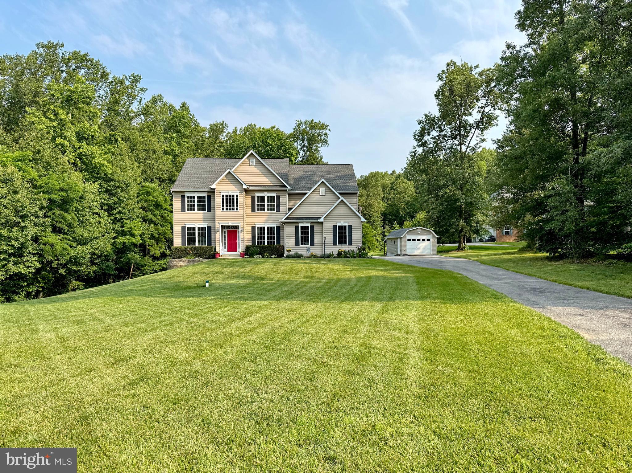 This Home Has It All – Location, Amenities & Space! From the moment you arrive, you'll know this home is something special. Beautifully landscaped and meticulously maintained, it offers the perfect blend of luxury, comfort, and functionality—inside and out. Step inside to discover a spacious layout designed for both everyday living and elegant entertaining. The main level boasts a desirable in-law suite with private bath, ideal for multigenerational living or hosting guests in style. A gourmet kitchen with high-end finishes opens to a welcoming family room featuring a cozy gas fireplace, while a separate dining room and a dedicated office add to the home's thoughtful design. A convenient half bath completes the main level.
Upstairs, you’ll find five generously sized bedrooms and three full baths, including a luxurious primary suite with a sitting area, large walk-in closet, soaking tub and separate shower. Laundry is located on the upper level for added convenience. The home also features a full basement with a potential 7th bedroom and full bath, a large rec area, and abundant storage space—perfect for any lifestyle. Step outside into your own private backyard oasis. Whether relaxing or entertaining, you'll love the multi-level decks, retractable awning, and your very own swim spa with hot tub, all overlooking a beautifully manicured yard. Additional highlights include a 2-car attached garage, oversized driveway, and a detached garage with heat, A/C, and electric—perfect for a workshop or additional storage. Plus, lean-to's behind both the garage and shed provide extra space for lawn equipment or outdoor gear. All of this in a prime location close to schools, shopping, dining, and more. This is the one you've been waiting for—schedule your private showing today!