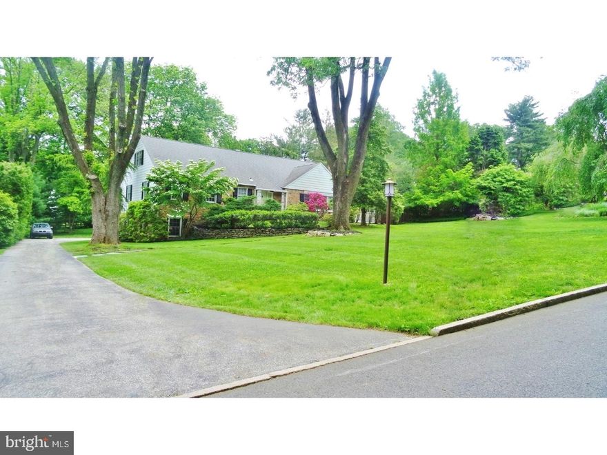Sought-after First Floor Master Suite Classic Stone home in Gladwyne, walking distance to the Philadelphia Country Club, one of only 6 homes on exclusive North Lane! UNDER a million!! Features 4 large light-filled Bedrooms and 3 Full Baths. Entry Foyer opens to spacious Living Room large with picture windows and wood-burning fireplace and built-in Bookcase. The gleaming hardwood floors opens to sunny Dining Room with elegant architectural details and French Doors that open out to large deck overlooking serene grounds on almost 1-Acre. Granite Kitchen has Center-island, Bosch Stainless Steel Appliances; Double Ovens, Gas Range, Side-by-side Fridge and Dishwasher. Coveted First Floor Full Master Suite with large walk-in closet and large windows. 3-Season Room with Hot Tub, Sunlit Office/Library, Plus 2nd Bedroom and Full Bath complete the 1st floor of this spacious home. Upstairs features 2-Xtra large Bedrooms, Full Bath and Playroom or Study. Additional features include hardwood floors, Central HVAC, very large walk out Lower Level with high ceilings, a 2-Car attached Garage and a tranquil back lawn. Fantastic Value in this multi-million dollar neighborhood!!!