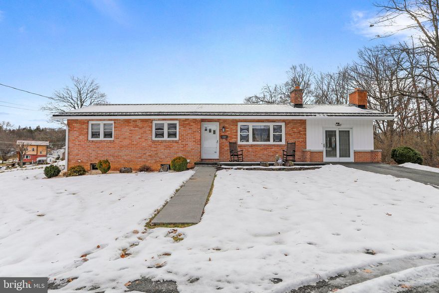 Home Sweet Home in a Mid-Century Classic with All the Chrome! This well-appointed, solid brick home boasts a classic floor plan encompassing just over 2,200 sq. ft., featuring 4 bedrooms and 2 full bathrooms on a full, partially finished basement—suitable for almost any living configuration. Relax and unwind under the protection of a new metal roof and the comfort of a recently replaced HVAC system. Additional upgrades include freshly renovated bathrooms and upgraded floor coverings, ensuring a modern touch to this timeless gem. Tastefully landscaped, the property features a covered rear patio and hot tub, creating the perfect setting for four-season outdoor entertaining. Embrace the charm of small-town living in this West Virginia retreat. Don't miss the chance to make this mid-century classic your Home Sweet Home.