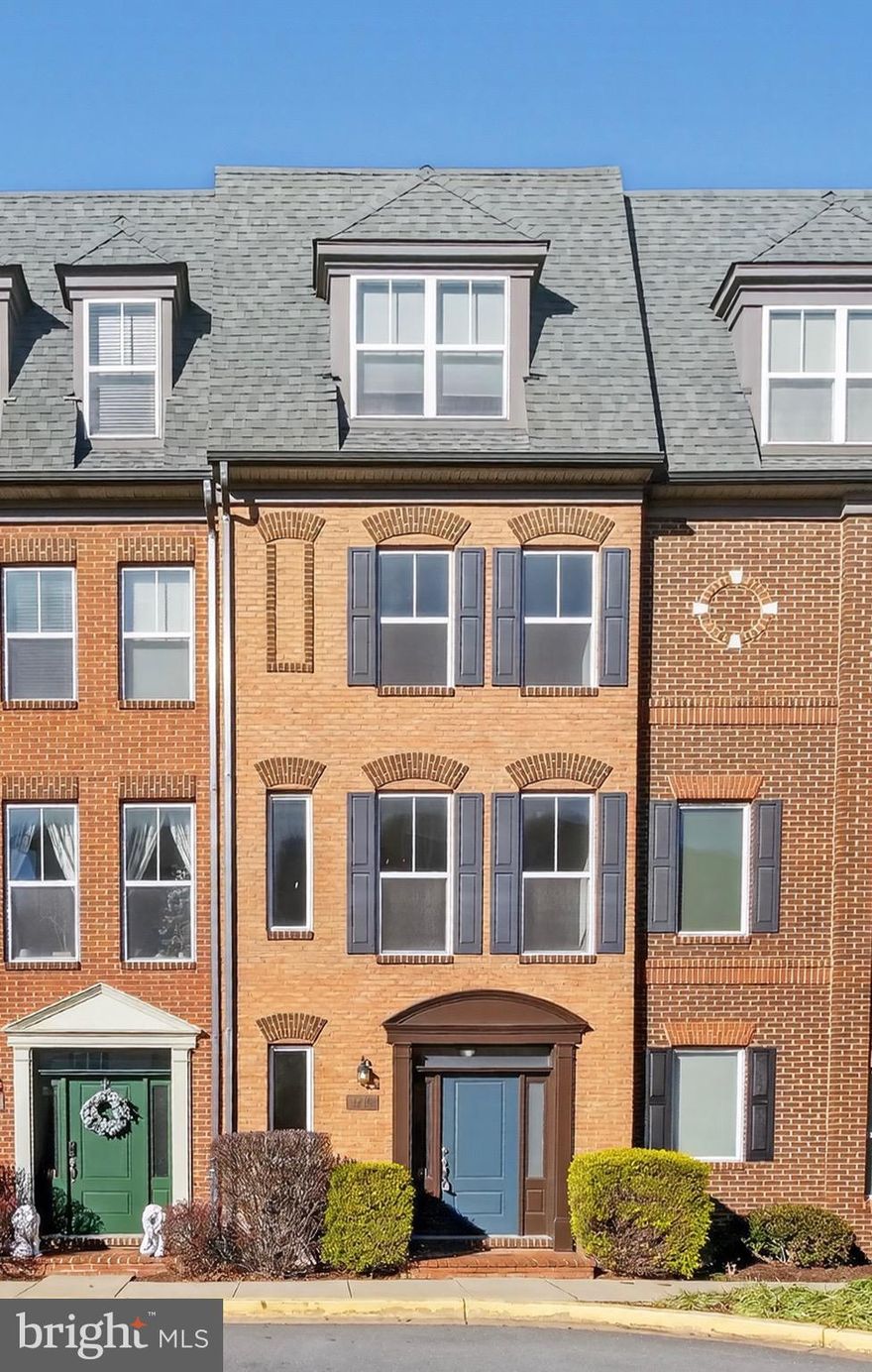 Welcome home to Monocacy Park, where luxury and comfort come together in this stunning four-level townhome. From the moment you enter, you’ll be captivated by the high-end finishes and thoughtfully designed living spaces. The first level features a spacious foyer that can easily serve as a sitting area, home office, or study, along with convenient access to the attached garage and a half bath. Upstairs, the second level is the heart of the home, filled with natural light from large windows and offering an open, inviting layout. Enjoy relaxing by the cozy gas fireplace, hosting dinner parties, or gathering around the kitchen island for casual cocktails. The expansive kitchen showcases exposed brick, 42-inch cabinetry, stainless steel appliances, granite countertops, a generous island, a built-in pantry, and a charming dining area. The third level includes a laundry area, two well-sized bedrooms with large closets, and a full bath. The fourth level is dedicated to the private primary suite, featuring spacious wall closets, a sitting area, and a luxurious ensuite bath with a standing shower, soaking tub, and double-sink vanity. Step outside to your own private rooftop balcony—perfect for unwinding at the end of the day. Ideally located just minutes from Route 26, Route 15, grocery stores, restaurants, and vibrant downtown Frederick. This turnkey, modern townhome won’t last long—schedule your showing today.