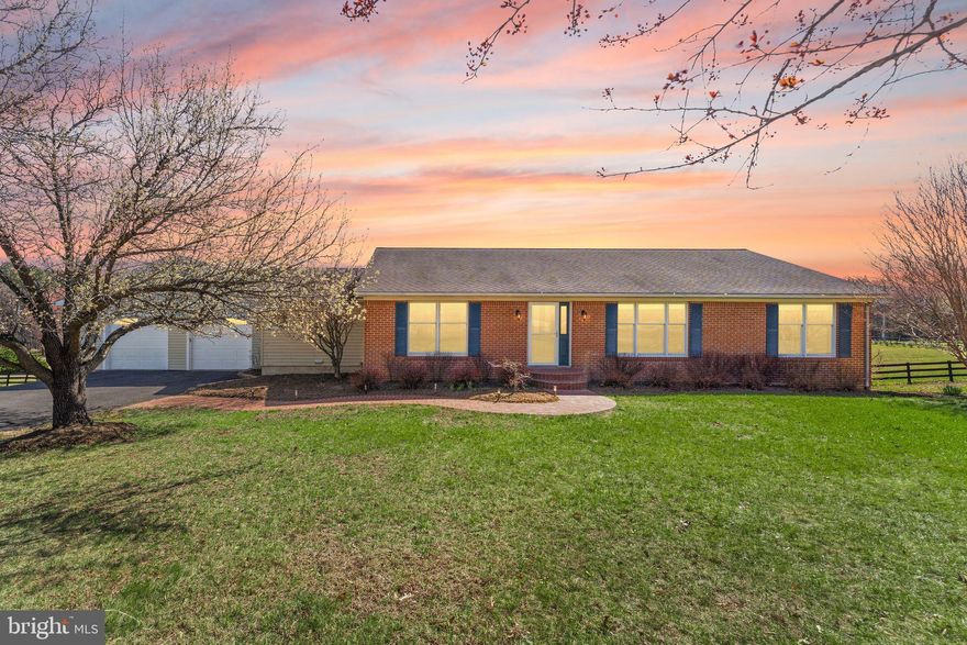 Open house Sat 3/28  from 2-4 and Sunday 3/29  from 2-4 pm Set on over 3.5 acres with no HOA, this extensively updated home offers true main-level living in a peaceful neighborhood. All four bedrooms and two remodeled bathrooms are on the main level, and a huge finished lower level adds even more flexible space. A variety of 2025-2026 updates include renovated bathrooms, refinished hardwoods, new appliances, new carpet, fresh paint inside and out, updated lighting and ceiling fans, new door hardware, and new landscaping. Step inside to hardwood floors, a family room, and a dining room with classic crown and chair rail moldings. The home’s generous footprint may surprise you. A spacious addition created the gourmet kitchen, which features granite countertops, quality cabinetry with plenty of storage, double wall ovens, an upgraded stainless refrigerator and dishwasher, and a center island with bar seating. An eat-in dining area and a cozy nook create a natural gathering space with sliding doors to the backyard. The primary bedroom includes a remodeled en-suite bath with a steam shower, vanity, and lighted mirror. Three additional bedrooms share a beautifully remodeled hall bath with contemporary finishes, a white Shaker vanity, and double sinks. Laundry room also on the  main level. Downstairs, the finished lower level features a large rec room with a fireplace, a built-in wet bar with cabinets, a wall of bookshelves, and walk-out access to the yard. A full remodeled bathroom, utility room and a home gym area complete the space, with 3rd garage access on this level. Outside, the expansive flat backyard is fully fenced, with over 3.5 acres giving you room to spread out however you see fit. The neighborhood is tucked away but still just a quick drive into historic downtown Leesburg for dining, shopping, and everyday conveniences, and right near the wineries and breweries of Lucketts and Loudoun Wine Country. Exceptional space and updates, with everything you need close by!