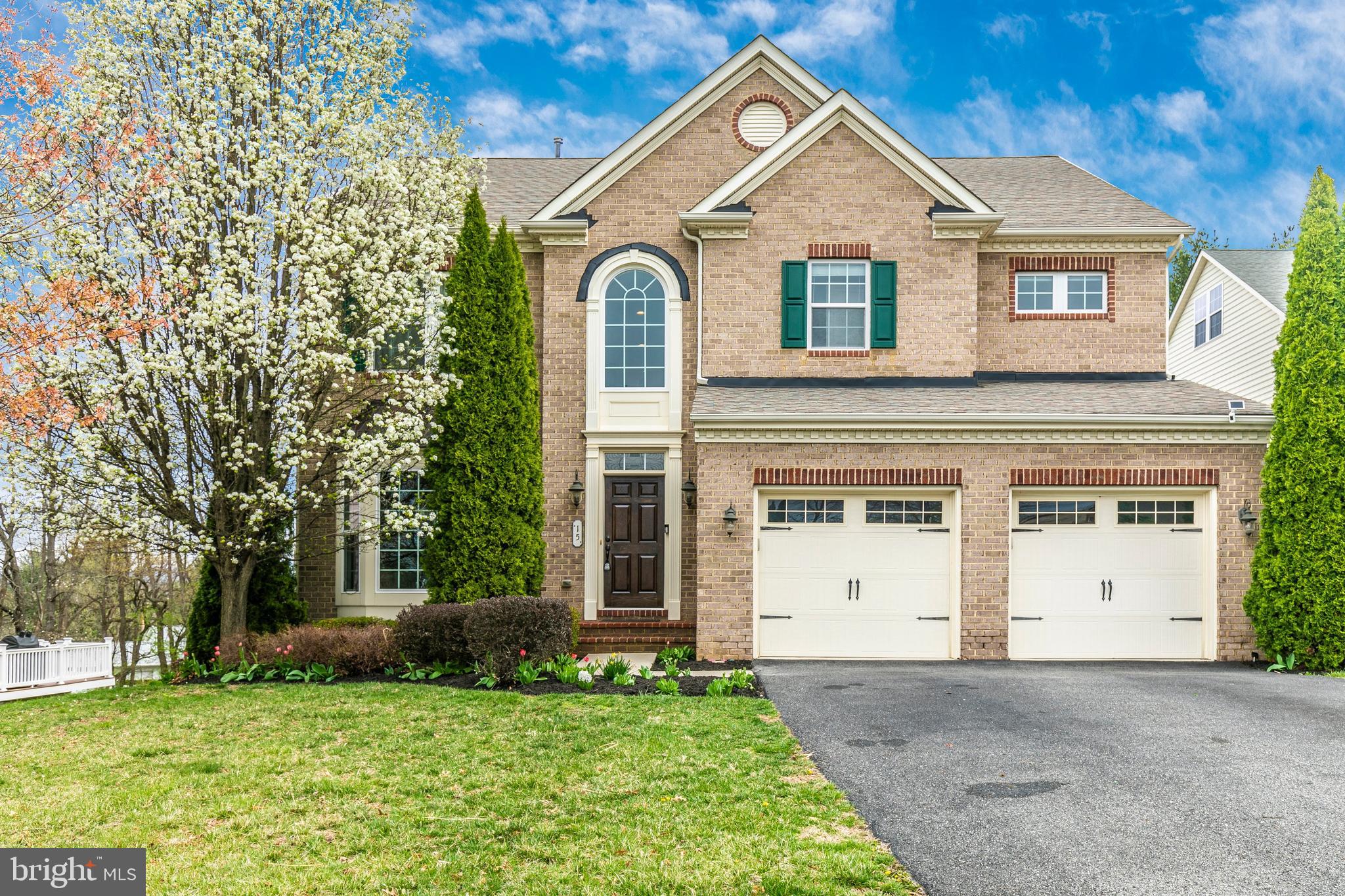 FRESH PAINT IN MANY AREAS. MOVE IN READY. Imagine cozy evenings by the gas fireplace in this stunning brick-front colonial in Glenbrook! Step into a grand two-story foyer with gleaming mahogany hardwood floors, leading to a gourmet kitchen with granite countertops, a central island, and high-end cabinetry—perfect for family gatherings. The luxurious primary suite boasts a tray ceiling, dual walk-in closets, and a spa-like ensuite with a soaking tub and bidet. Three additional spacious bedrooms include a Jack-and-Jill bath and one bedroom has a private ensuite. Entertain in the finished walkout basement or relax on the charming stone patio and 20x20 composite deck, ideal for seamless indoor-outdoor living. With tray ceilings, Corinthian columns, and a private office, every detail exudes sophistication. Walk to restaurants, grocery stores, and Middletown Park, with Middletown schools and downtown Frederick nearby.