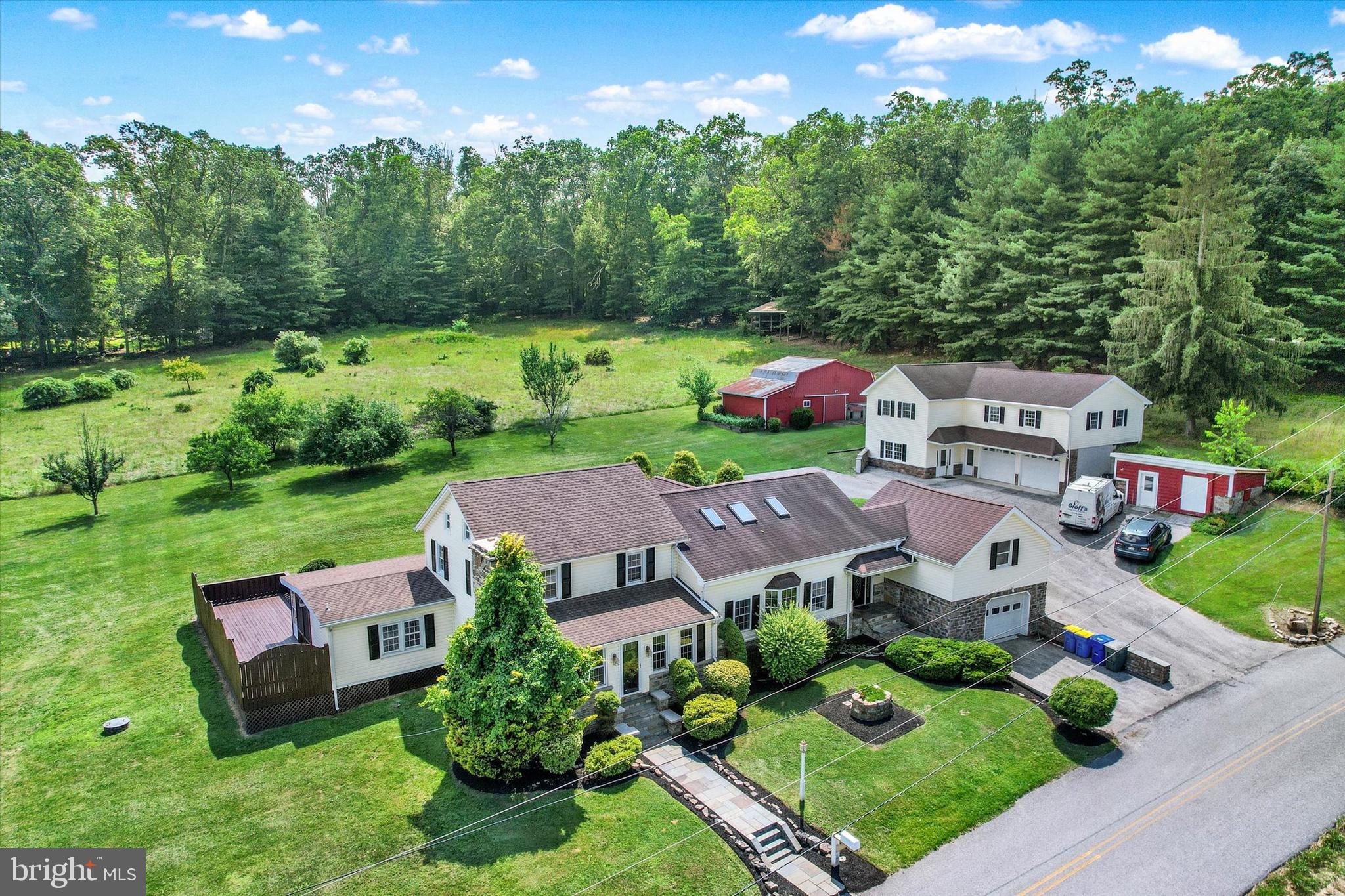 Remarkable Opportunity to own an Estate and Generational Type Property with Endless Offerings! Recently Remodeled with Incredible Blend of the "Old" and "New"! A Must see to Truly Appreciate all Amenities! Main Portion of Home is a Restored Log House with New Designer Kitchen with Huge Island, Farm House Sink and Granite Countertops! Enormous Family Room with Vaulted Ceilings and Skylights Flooding the Area with a Beautiful and Bright Ambiance! Large Loft Overlooks Family Room and can be Used for Kids Playroom, Offices, or Additional Bedroom... Main House has 4 Bedrooms Which Include a First Floor Master Suite with Attached Full Bath! Large Mudroom and Laundry off Main Entrance! Screened In Porch and Large Deck Area to Enjoy Stunning Views of over 3.5 Acre Property! New Painting and Flooring Throughout Entire Property, New Central AC and Hot Water Heater in Main House! Large Building which contains Oversized two Car Garage and First Floor Office Space with Two Large Offices, a full Bath, and a Waiting Area Inside the Main Front Door. Second Floor of Building Contains a Full Apartment/Guest House with Full Kitchen and Bath, Family room, Laundry and Private Bedroom! Additional Buildings Include Potting Shed, Tool Shed and 21X30 metal Pole Building! Large Free Standing Lean-to in Rear of Property! This Gem of a Property Contains over 3.5 Acres of private Land!