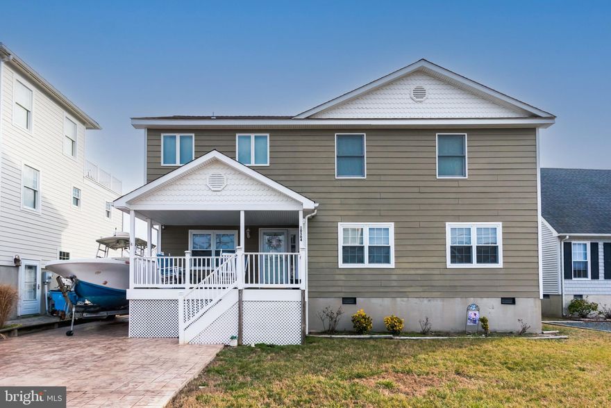 REDUCED, REDUCED PRICE:  This home originally built in 1975 was completely renovated and rebuilt in 2009.  Encapsulated crawl space  is just the start for this lovely 2 story home with 4 bedrooms (1 master  on 1st floor and one on 2nd floor),  powder room 1st floor.  Screened porch off the kitchen  adjoined  by deck and a pool.  Open floor plan with living room, gourmet  kitchen , gas fireplace and hardwood floors (not laminate) . Upstairs offers, den, 2 more bedrooms with a bath to share and a 2nd Master with bath which offers a large HEATED tile shower floor.  Lots of storage and great views of the Ocean City Skyline at night.  Easy access to the bay for fishing and crabbing.  Stamped driveway gives you a place to  dry dock your boat and still park 4 cars.  Exterior siding is James Hardy cement lap Don't miss out seeing this home!!
