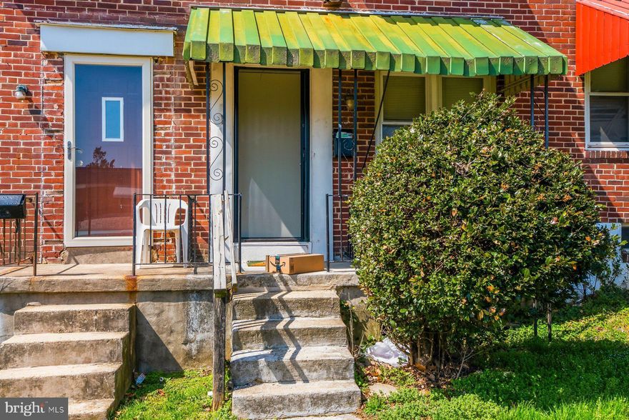 The perfect investment opportunity awaits you with this 2BR/1BA Townhome located on the sunny side of the street in Edmondson Village.  This home features a covered front porch with a lush green front lawn, a fenced rear yard with off street parking, some green space, and an entrance to the lower level. Imagine the possibilities this home offers including close proximity to shopping, restaurants, and commuter routes.