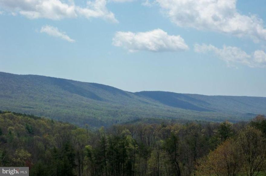 Spectacular long-range views of Sleepy Creek Mtn. This two acre lot at the end of a cul-de-sac is in one of Morgan County's finest communities. Hillcrest offers underground utilities, reasonable covenants to protect your investment and handsome homes as neighbors. Current septic permit on file for a four-bedroom home. Just off Route 9, it is convenient to both Martinsburg and Hagerstown.
