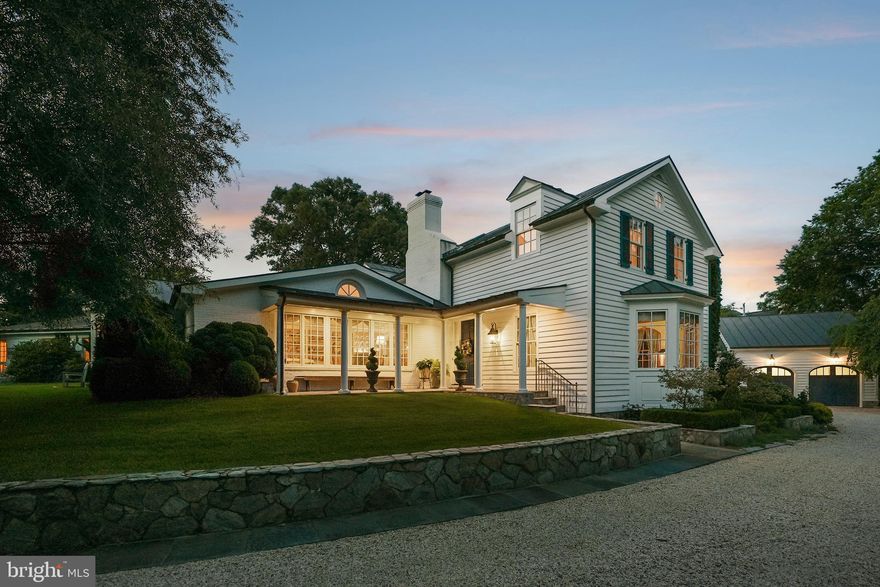 This charming estate is located at the end of a private drive on one of Alexandria's most sought-after streets. Featuring 1.37 landscaped acres, this home offers country estate privacy that is easily accessible to Old Town, Washington, DC, and Reagan National Airport.  

The 5,119 square foot main residence was designed as a spacious classic farmhouse, where every window frames the gardens and extensive lawns. Reimagined by a builder and gardener for their family, the home’s elegant custom architectural details include high ceilings up to twelve feet, centuries-old heart of pine floors and library built-ins, four fireplaces, seven bathrooms and three primary suites. The large kitchen with family/breakfast area includes two working areas with sinks and a cozy office. A first-floor primary suite has a dressing room, two full baths and walk-in closets. Steps away is a laundry/home keeping room with its own outside entrance.

Several outbuildings are integral parts of the estate’s charm and unique character- a lovely guesthouse adjacent to the in-ground pool area, an oversized two-story garage with attic and four storage bays and a custom imported glasshouse from England. The setting of the property, its privacy and improvements, would make you think it was the Virginia countryside! 

The property's grounds feature several gardens, which were showcased during the national Garden Conservancy's 2025 Open Days event. Stately oaks, boxwoods, topiaries, rare conifers, shrubs and a woodland walk ensure year-round interest in the landscape of this legacy property