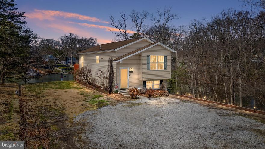 Nestled in the woods this waterfront home offers peace, tranquility and fabulous views of the water. In the still of the morning while relaxing on the deck you may catch a glimpse of the deer, geese and other wildlife.  It's the perfect place to call "Home". Freshly painted, newer carpet and lighting fixtures, it's ready to move in. Looking for a workshop? We've got you! One last juicy tidbit, this home has an assumable FHA loan at 3.25%!!! Call your agent today and let's get moving!