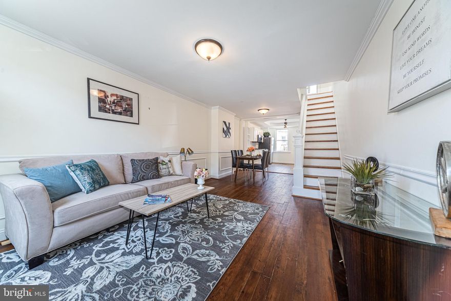 PICTURE PERFECT PATTERSON PARK RENOVATION LOCATED 2 BLOCKS FROM PATTERSON PARK!  This inviting rowhome features an open floor plan with crown molding & wainscoting throughout the main level, a spacious living room with exposed brick, separate dining area, gourmet kitchen w/ ss appliances & tile backsplash, upper level with 2 generously sized bedrooms with hardwood floors and a full bath, an unfinished basement with laundry area and plenty of storage, and a rear fenced patio!  Pack your bags and move right in!