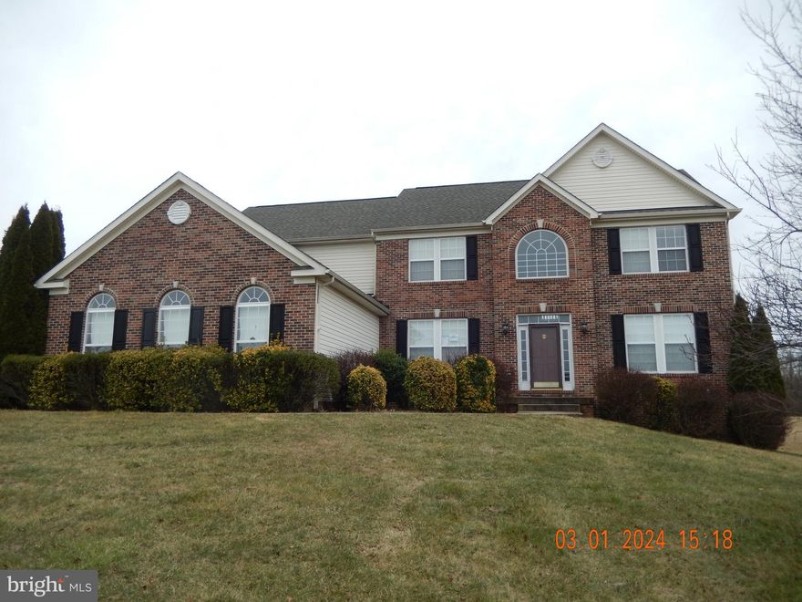 Immaculate 4 bedroom , 4 bath brick faced colonial located in small rural subdivision with 3 acres of land . Open floor plan includes an updated gourmet kitchen with new energy efficient stainless appliances including a double wall oven and center island cooktop! You will love sitting in the sunlit morning room with views of pastureland while enjoying your favorite meal.Two-story living room with floor to ceiling stone gas fireplace Three bedrooms are ample sized with large closets and a shared full shower/ tub combo bathroom. The primary master suite includes a double suite bedroom with walk in closets, sitting area, an in-room exercise or office space. The primary bath includes a garden corner soaking tub with separate stand up shower, double sink vanity and cabinetry. Finished basement includes full bath with additional room that could be used as additional bedroom.