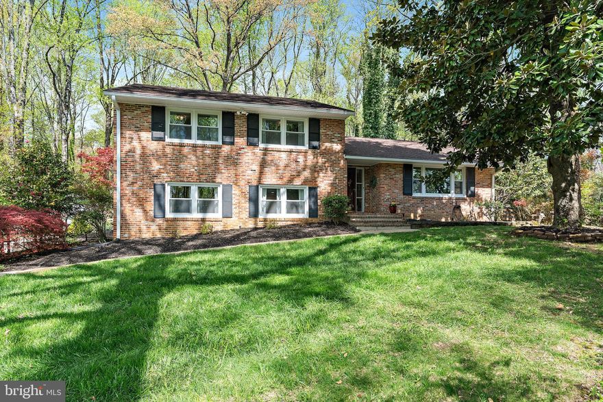 Welcome to 2651 Ogleton Road — where lifestyle meets location!
Nestled in the sought-after waterfront community of Annapolis Roads, this beautifully updated 4-bedroom, 3-bath home offers nearly 3,000 square feet of living space, sitting gracefully atop a lush and private .62-acre lot. The home is surrounded by mature trees and professionally landscaped gardens — and the fully fenced backyard with a stunning stone patio offers the perfect vantage point to take it all in. Whether you’re entertaining or unwinding, this outdoor space is truly a retreat.
Just a short walk to the Chesapeake Bay, you’ll enjoy exclusive community access to a sandy beach, boat ramp, kayak storage, firepit, playground, and miles of scenic wooded trails. It’s a nature-lover’s dream, all just minutes from Quiet Waters Park and downtown Annapolis.
Inside, hardwood floors run throughout the main and upper levels. The renovated gourmet kitchen features 42” cabinetry, granite countertops, a ceramic tile backsplash, stainless steel appliances, and built-in wine storage. The layout flows seamlessly to a flexible space for dining or sitting, with French doors leading to the patio and backyard sanctuary.
The living room is warm and inviting, anchored by a handsome brick fireplace with a pellet stove insert, offering both ambiance and energy efficiency. Crown molding and expansive windows fill the space with character and light.
Upstairs, all bedrooms are generously sized with hardwood floors and ample closet space, including custom built-ins. The primary suite has just been renovated with a stunning new marble bathroom, blending timeless elegance with modern design and finishes.
The lower level offers a spacious great room with a separate entrance — ideal for guests, a home office, or multi-generational living. A third full bath has been tastefully updated, and the laundry room is outfitted with luxury vinyl flooring, extra cabinetry, and freezer .  One level below that, you’ll find a massive bonus space with walk-out  access to the side yard — perfect for a rec room, gym, studio, or storage.

This is more than a home — it’s a lifestyle. Come experience it for yourself!
