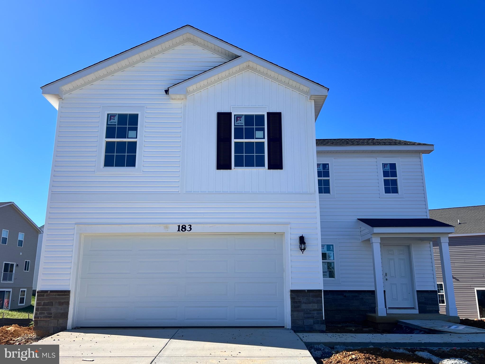 This Deerfield is a two-story home with 4 bedrooms and 2.5 baths. The kitchen features a walk-in pantry and a large island with a double sink, which gives plenty of room for entertaining. Stainless steel appliances, 25 cu ft side by side refrigerator with in-door water/ice, multi cycle dishwasher, disposal, range and microwave with Aristokraft kitchen cabinetry, LED work area kitchen lighting and granite countertops. America's "Smart Home Technology" featuring Quisys IQ HD touchscreen with camera, Wi-Fi video doorbell, Echo Dot speaker with Alexa, Z-Wave programmable thermostat, smart light switch and Keyless Entry front door lock with deadbolt, flat screen prewires with cat-6 outlets in owners suite and living area, and finally a Wi-Fi enabled garage door opener. LVP flooring on main level, laundry and bathroom areas, wall to wall carpeting in bedrooms, and LVP on main level and bathrooms. ceiling fan pre-wires