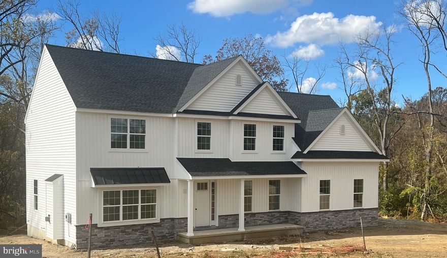 In the heart of picturesque Chester County, a new construction endeavor is taking shape in Avon Grove School District, promising an unparalleled blend of luxury, comfort and breathtaking views.  Nestled on spacious lots, four single- family homes stand as epitomes of modern architectural marvels, offering a harmonious fusion of elegance and functionality.
You are greeted by the allure of space and tranquility with each residence boasting its own generously sized lot.  Whether it's for outdoor recreation, gardening, or simply enjoying the serene surroundings, these spacious lots provide ample room for all your desires.
The homes themselves are a testament to meticulous craftmanship and thoughtful design.  An amazing open floor plan welcomes you, seamlessly connecting living spaces and creating an atmosphere of warmth and inclusivity.  With 10 foot ceilings gracing the main level, a sense of grandeur permeates throughout, enhancing the feeling of openness and freedom.
Panoramic views await from every window, inviting nature's beauty indoors and allowing you to revel in the changing seasons and stunning vistas that surround you.
Step into the coffered ceiling Family Room, where sophistication meets comfort.  The intricate detailing of the coffered ceiling adds a touch of architectural splendor, while the  beautiful gas fireplace and abundant natural light create an inviting space for relaxation and entertainment.
The expansive open floor plan effortlessly transitions from the Family Room to the Gourmet Kitchen, where luxury features abound.  From exquisite cabinetry and high -end appliances to designer fixtures, every aspect of the Kitchen is tailored for both style and functionality.
Luxury extends beyond the main living areas, with customization options available to suit your unique preferences and lifestyle.  Whether it's adding a personal touch to the Master Suite or creating additional family recreational space in the Lower Level, the possibilities for customization are endless.
In the Avon Grove School District, minutes from Downtown Kennett Square, these homes offer more than just a place to live, they offer a lifestyle of unparalleled luxury and comfort.  With spacious lots, amazing open floor plans, panoramic views and luxury features throughout, these residences redefine modern living in the most spectacular way.  Call today and schedule your appointment. 
Photos of similar houseplan and customization ideas from other homes we have constructed.
Only four homes to be constructed at this location.  Lot sizes 1.9 to 5.3 acres.   This lot is 2.1 acres.