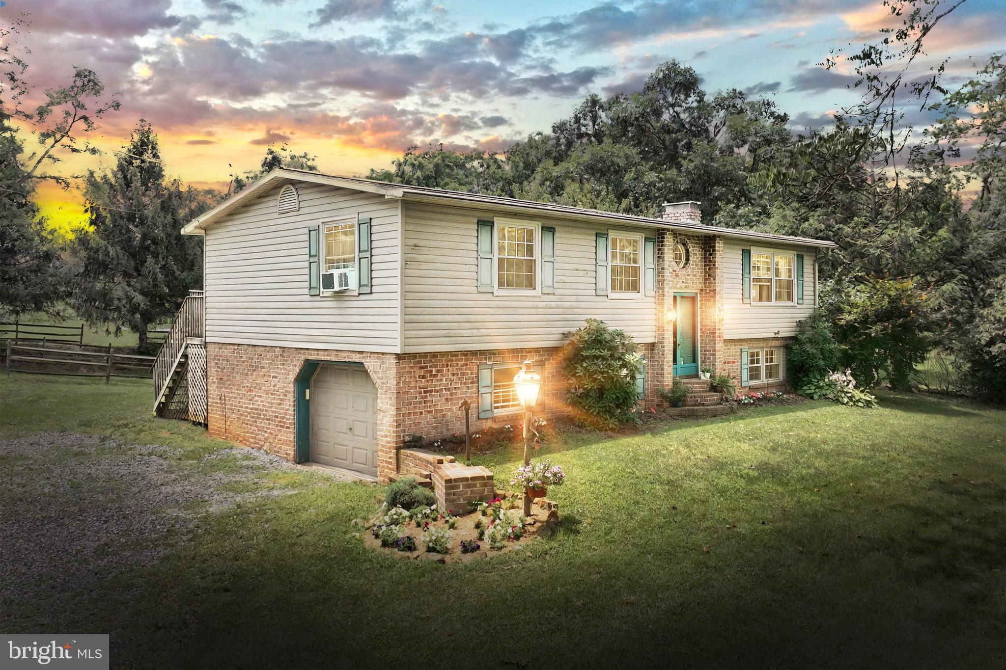 Welcome to this cute, brick and vinyl bi-level with almost 2000 sq ft of living space on both levels with 2 full baths and 2.5 acres. Plus a brand new roof! The 4-stall barn, hay storage area, run-in shed and large pasture will be great for your horses or other animals you may want to bring. As you can see there is plenty of room for a large garden. The home features a one car garages with some extra storage. Bring your ideas to make this house your home.
