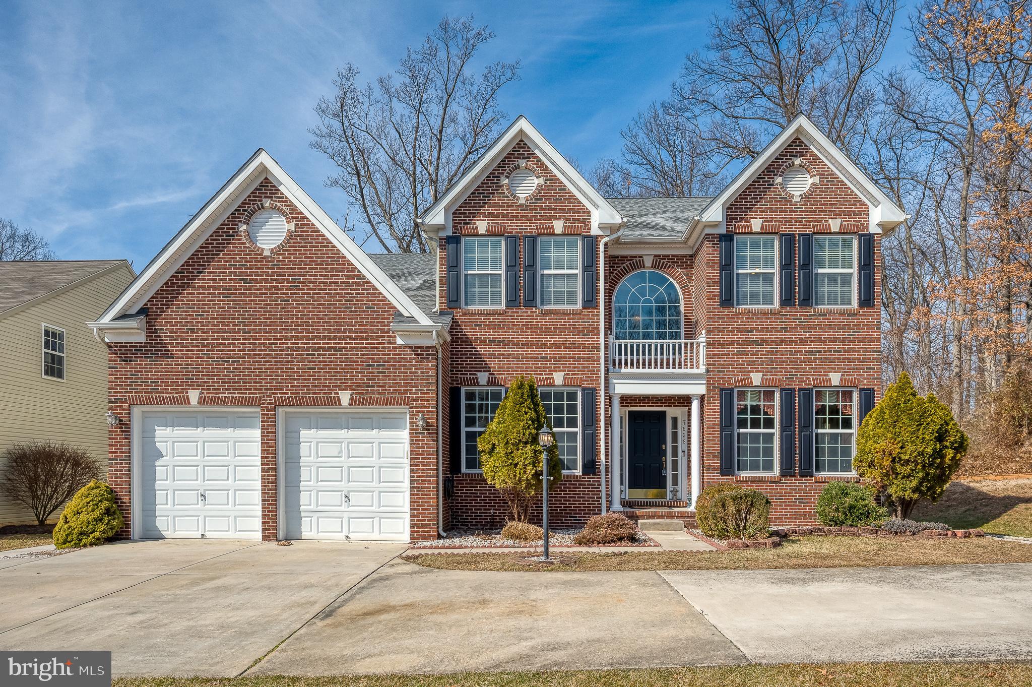 Welcome to this remarkable 6-bedroom, 3.5-bath Colonial residence located in the sought-after Cedar Lane Farms neighborhood. This home seamlessly blends comfort, style, and functionality. Situated in a tranquil community, this beautifully maintained property offers a thoughtfully designed layout, guiding you through each level with intentional flow and purpose. Gleaming hardwood floors and elegant crown molding set the stage for the main level’s open and airy design. To the right, a sun-drenched formal living room offers the perfect setting for quiet gatherings or a home library. Adjacent is the formal dining room, enhanced by wainscoting and a classic chair rail—ideal for hosting family dinners and holiday celebrations. At the heart of the home, the spacious kitchen features tile floors, recessed lighting, modern stainless-steel appliances, granite countertops, a large pantry, and abundant cabinetry. Enjoy the convenience of a built-in desk, a double wall oven, and an island with a breakfast bar overhang. An additional high-top breakfast bar extends from the breakfast nook side, offering even more seating. The bright breakfast nook, accented with crown molding and a ceiling fan, is bathed in natural light—creating a cozy space for morning coffee. The inviting family room, anchored by a charming fireplace, offers a warm retreat for relaxing evenings. Completing the main level is a private home office, a convenient half bath, and a laundry room with direct access to the attached garage. Upstairs, crown molding continues throughout the hallways, adding a touch of elegance. French doors open to the luxurious primary suite, a true sanctuary featuring a generous walk-in closet and a spa-inspired ensuite bath with a soaking tub, separate walk-in shower, and dual vanities. Four additional spacious bedrooms, each filled with natural light and ample closet space, provide flexibility for family, guests, or creative spaces. An updated full hall bath with modern fixtures completes this level. The partially finished walk-out basement is designed for ultimate versatility. It features a second full kitchen with granite countertops, stainless steel appliances, recessed lighting, a dedicated pantry, and a breakfast bar—ideal for multi-generational living or extended guest stays. The expansive recreation area, with tile floors, recessed lighting, and a charming brick fireplace, offers a cozy yet functional space for a media room, fitness area, or game nights. Two additional bedrooms and a full bath provide private retreats for guests or extended family. Direct access to the backyard makes outdoor activities a breeze. Step outside to a beautifully landscaped backyard, a true extension of the living space. The two-tier composite deck is perfect for outdoor dining and summer BBQs, while the lower-level patio offers a shaded spot for relaxing afternoons. A charming gazebo invites peaceful moments, and the spacious storage shed keeps tools and equipment neatly tucked away. With ample storage throughout, an attached garage, and a prime location near shopping centers and major commuter routes, this exceptional Colonial property in Cedar Lane Farms offers the ideal balance of convenience, luxury, and thoughtful design. Don’t miss the opportunity to call this stunning property your forever home!