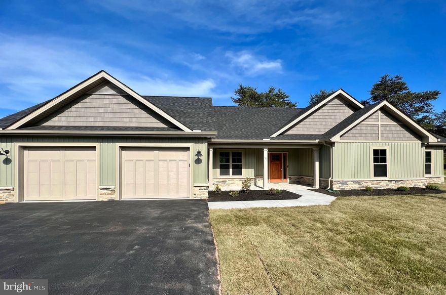 Welcome to your dream home nestled amidst the serene beauty of The Woods Resort.  This new home sits along the lush fairways of The Woods Resort golf course with beautiful views all around.  The exterior of the home was tastefully designed to blend into the surrounding landscape while displaying modern sophistication.  The yard is sodded in the front and back to provide a nicely manicured lawn that is move in ready.   In the evening, this home stands out from all others with custom LED lights fitted in the soffits. 
Step inside to be greeted by the cathedral ceilings and stone fireplace.  The entire home is accented with custom trim work and upgraded cabinetry throughout.    The dual sliding doors allow for incredible natural light and will take you outside to the full-length rear patio that provides panoramic views of the golf course.  Immediately off of the kitchen is a large mudroom complete with washer & dryer hookups.  In the mudroom you'll find a hall tree with bench, custom cabinets, a ceramic tile backsplash and a large sink with an upgraded Moen faucet. 
When it's time to retreat to the Owners Suite, it will be like stepping into a private oasis.  A third sliding door will take you from this suite to your rear patio allowing you to step right outside and enjoy the sunrise in the mornings.   The Owners Bath is designed with a large tile shower and elegant tile floor, large linen closet, upgraded cabinetry and a dual bowl vanity.  The additional bedrooms are designed with privacy and comfort in mind for your guests.  In the hallway, you'll find a full bath with a dual bowl vanity as well as a linen closet.
Although this home seamlessly blends into the natural beauty found at The Woods Resort, make sure you do not miss your opportunity to visit this home while it is available!