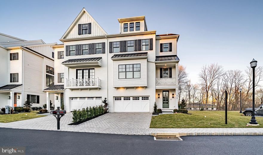 Welcome to 421 Maplewood Ave, a gorgeous resale luxury twin home in the Wayne Walk community of Wayne, PA. Just three years old, this 3,675 sq ft luxury home offers elegance and modern living in an enclave of eight exclusive carriage homes. Built in 2022 by David Semerjian Builders, this ease of living HOA community is situated in the heart of Wayne and offers direct access to the Radnor Trail. Designed by R.A. Hoffman Architects, this exceptional twin boasts an open and flowing floor plan that offers an abundance of natural light and 10' ceilings. 
421 Maplewood’s floor plan includes 4 bedrooms (an office on the main floor can be used as bedroom 5) 3 full bathrooms and two powder rooms on 4 levels of living. The grade floor level includes an entry foyer and a bonus room perfect for entertaining with a built-in bar and fireplace with slate surround. A powder room and office or bedroom 5 is also on this level. The 2 car attached garage completes the ground level. Ascend to the above floor via the staircase with continuous upgraded handrails or the convenient elevator. Level 2 (the main living level) showcases a gourmet kitchen with custom Medallion cabinetry, marble countertops, Wolf and Sub-Zero appliances, an adjoining breakfast room, formal dining room, and large family room with a custom marble gas fireplace. Level 3 (bedroom level) offers a primary suite oasis with luxurious ensuite bath featuring Kraftmaid cabinetry, a large shower, soaking tub, marble floors, and vanity with 2 sinks.  2 walk-in custom closets and dressing area complete this luxurious suite. An additional bedroom and ensuite bathroom and the conveniently located laundry room completes this floor. The loft area on level 4 was finished to include 2 more bedrooms, a Jack and Jill bathroom, and 2 storage closets. The full basement offers storage. A five stop elevator offers convenient access to all floors. Fantastic outdoor balconies on several floors offer peaceful outdoor living.
Outstanding Features of the Wayne Walk community:
Located in highly coveted Wayne, Pennsylvania, surrounded by beautiful landscapes.
Direct access to the Radnor Trail for peaceful walks and outdoor activities.
Close proximity to Downtown Wayne's dining, restaurants, championship golf courses, and award-winning schools.
Relaxed HOA living with exterior maintenance included.
Stone, brick, and James Hardie Hardiplank exteriors with lush landscaping and irrigation system.
Elegant paver driveways and sidewalks, accented by cobblestone curbs.
Public water and sewer services, with natural gas.
Attached two-car garage with additional guest parking.
Quick access to major thoroughfares and local train stations.
Luxurious Interiors featured on the Wayne Walk website:
Expansive living space on four floors with a five-stop elevator.
Gleaming 7 ½” wide-plank French Oak hardwood floors throughout.
Gourmet kitchen with Medallion cabinetry, quartz/granite countertops, and curated plumbing fixtures by Ferguson.
Kraftmaid cabinetry in all bathrooms.
Custom closet design.
Full basement with a 9 ft poured concrete foundation.
Ceiling heights of 9 ft on ground and bedroom levels, 10 ft on main living floor.
Exquisite trim package, Pella Lifestyle windows, and a Knotty Alder front entry door with oil-rubbed bronze hardware.
Recessed lighting and decorative lighting.
High-efficiency zoned HVAC system, tankless water heater, and high-efficiency insulation package.
Don't miss this opportunity to live in a low-maintenance community, a short walk from downtown Wayne's shopping and dining, and the highly-rated Radnor schools and train to Center City. Wayne Walk offers a turn-key HOA lifestyle with open space and Radnor Trail access, truly a Radnor gem.