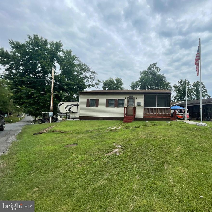 Great opportunity to own your own place here is Riverbend.  Nice corner lot close to the main attractions in Riverbend, pools, ball field, rec center and camp store and restaurant.  Spacious place with 2 bedrooms, plus bunk beds, full bath with tub/shower combo, large living room and dining area, screen in porch and storage for the toys with shed inside the storage area too.  Needs some updating, but worth it with all the space!   To view the property, Riverbend Park is a gated community, so you need to enter at the guard shack. Entry is not permitted without ID per the office rules. Bring IDs to the office or guard shack for visitor pass. THIS IS A SEASONAL CAMPGROUND -OPEN FROM APRIL 1 TO NOVEMBER 1. River Bend is a privately owned 400 acres recreational- vehicle camp resort with seasonal activities for members, families and guests. This great RV park is tucked away on the Upper Potomac River of West Virginia; River Bend is one of West Virginia's most popular family seasonal destinations. Just a short drive from the Washington and Baltimore metro area. Open with utilities from April 1 to November 1. (Lot owners have access to their property during the off season). Riverbend Park offers lots of fun and entertainment, or a great place to get away and relax. 10 miles of Deep water on the Potomac River, access for boating, fishing & swimming and other park amenities include 3 swimming pools, mini golf course, Horseshoe club, Boat club, Poker runs, Trick or Treat, Christmas in July, live bands, basketball court, tennis court, fireworks, car show, Church, restaurant, bar, convenience store, playground, volleyball, ball field and much more.
Listing Office