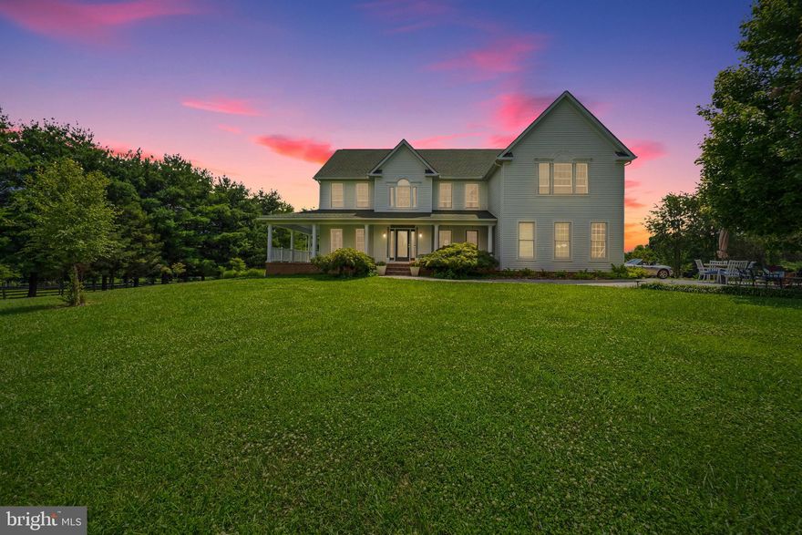 Welcome home to this stunning 4 bedroom, 2.5 bathroom home situated on an almost 3.5 acre lot! The recently refinished wrap-around porch beckons you to enjoy a cup of morning coffee or simply enjoy the serene view. Upon entering the home you are greeted by a stunning 2-story foyer with gleaming hardwood floors, retractable chandelier, and elegant staircase. Everything about this home is purposeful and promotes an easy flow throughout the home. Multiple arched door frames provide a seamless path from the front of the home into the heart of the home’s living space. To your right you will find the elegant, formal dining room and to your left is the front sitting room - a perfect space for a library, play room, or additional living room. As you continue through the arched doorways your eyes are drawn to the cathedral-height ceilings of the great room. This room is flooded with natural light from the massive floor-to-ceiling windows and is pulled together by a beautiful 2-story stone fireplace - truly a breathtaking room. The casual breakfast space and kitchen are adjacent to this light-filled room. The kitchen is fully-equipped with granite countertops, sub-zero refrigerator, commercial gas range with griddle, dishwasher and trash compactor, and convenient prep island - making meal preparation a breeze! A private office space and half bath complete this level. On the upper level you can retreat to the spacious and bright primary suite featuring cathedral ceilings, two large walk-in closets, and a private en-suite bathroom with soaking tub, shower, dual vanities, and toilet room. This luxurious suite provides abundant space for a private sitting room area - the perfect place to unwind! Three large bedrooms with full size closets, a hall bath and a spacious walkway overlooking the family room with 2 story stone fireplace complete the upper level. The unfinished 10’ ceiling walkout basement is perfect as additional storage or could be finished as additional living space, workshop or gym. Rough in for a full bath is included on this level. Construction of the home is 2x6 with blown in place insulation! The 30x40 2-story storage barn is perfect for yard storage or workshop. Surrounded by mature pines and fruit trees and located at the end of a private quiet pipe stem, this home is truly a retreat from the daily hustle and bustle. A pond site with plunge pool option has been dug with materials to complete the lower patio/pond area conveying with home purchase so you can complete to your preferences with the help of a contractor or as a DIY project! There are no restrictions regarding horses or animals, nor are there any HOA fees. An excellent location with Howard County schools and privacy, this is easily one of the most serene properties located in Western Howard County. Don’t wait to make this rare find your next dream home!