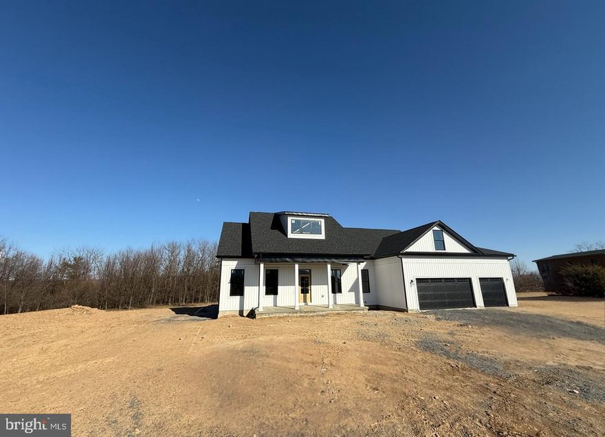 PANORAMIC MOUNTAIN VIEWS!!!! Stunning  modern ranch-style home has been thoughtfully designed with custom interior and exterior finishes. Nestled on two flat acres in a prime location, it offers breathtaking mountain views. This brand-new 3-bedroom, 2 bathroom home seamlessly blends luxury and comfort. Step onto the charming front porch and admire the curb appeal, featuring board and batten front siding, black front exterior windows, black garage doors, and black wrapped columns. Inside, highlights soaring 10 ft. walls  and vaulted ceilings  & oversized doors creates a bright and airy atmosphere. The living room showcases a custom-designed shiplap fireplace & wood beam accent on the cathedral ceiling—perfect for cozy evenings. The kitchen will be equipped with stainless steel appliances, LVP flooring, and granite countertops. The unfinished basement provides a blank canvas, allowing you to customize the space to suit your needs. Also has the rough-in plumbing for a future bathroom. Enjoy outdoor living on the spacious back porch, ideal for entertaining or unwinding while soaking in the serene surroundings. The three-car garage offers ample space for recreational vehicles, tools, or hobbies, ensuring flexibility to accommodate your lifestyle. Located just minutes from the Virginia line, this property is perfect for commuters while still providing the peace and tranquility of country living.